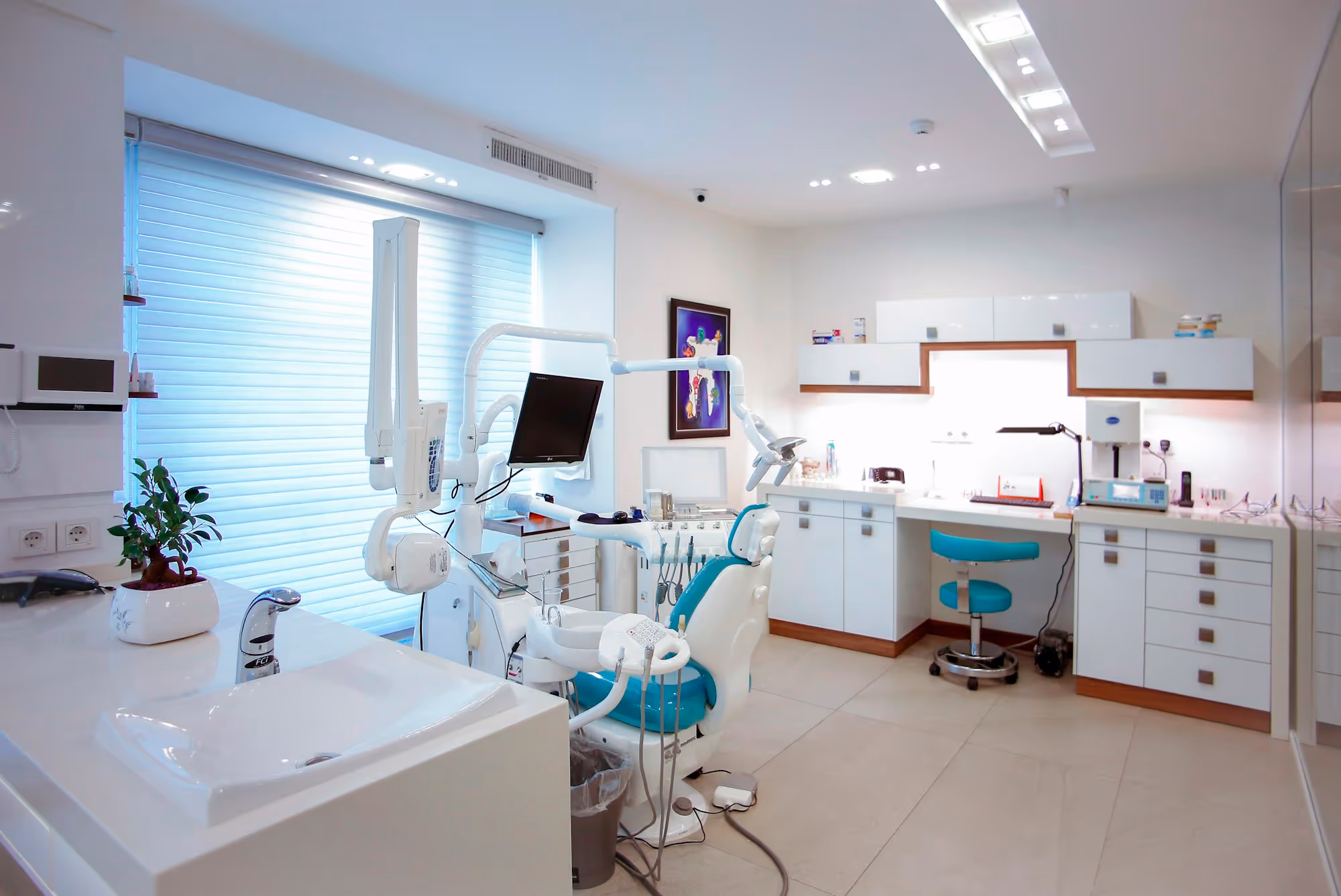 A dental treatment room with equipment, ready for the day.